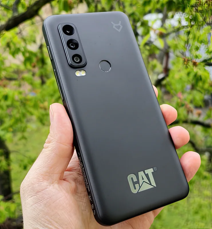 Held in one hand outdoors, showing the size of the 6.58-inch body