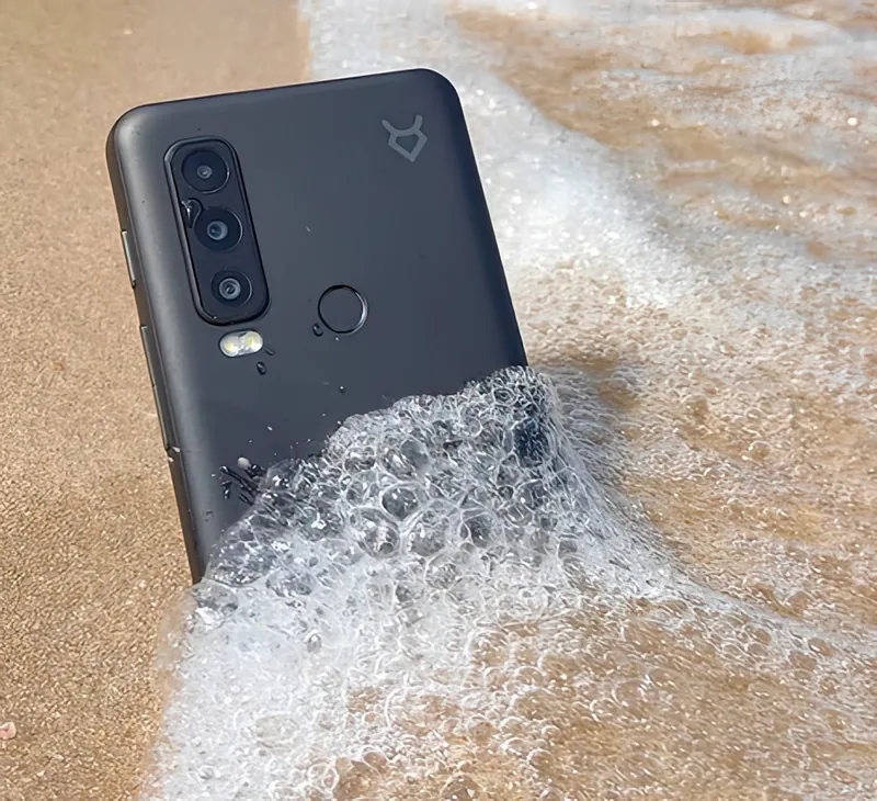 Half in the surf on wet sand